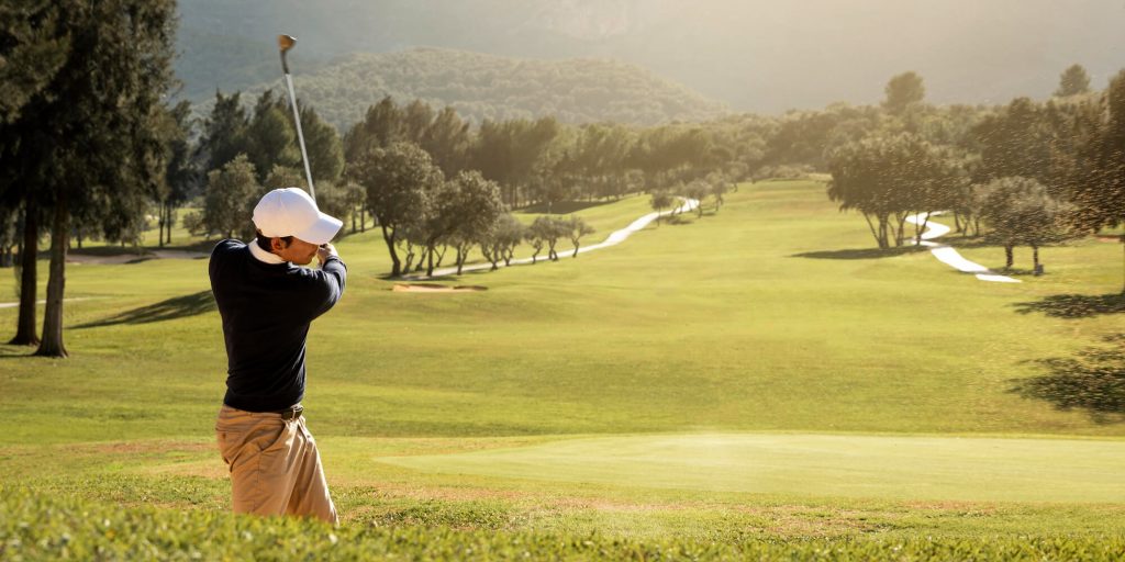 Man playing golf